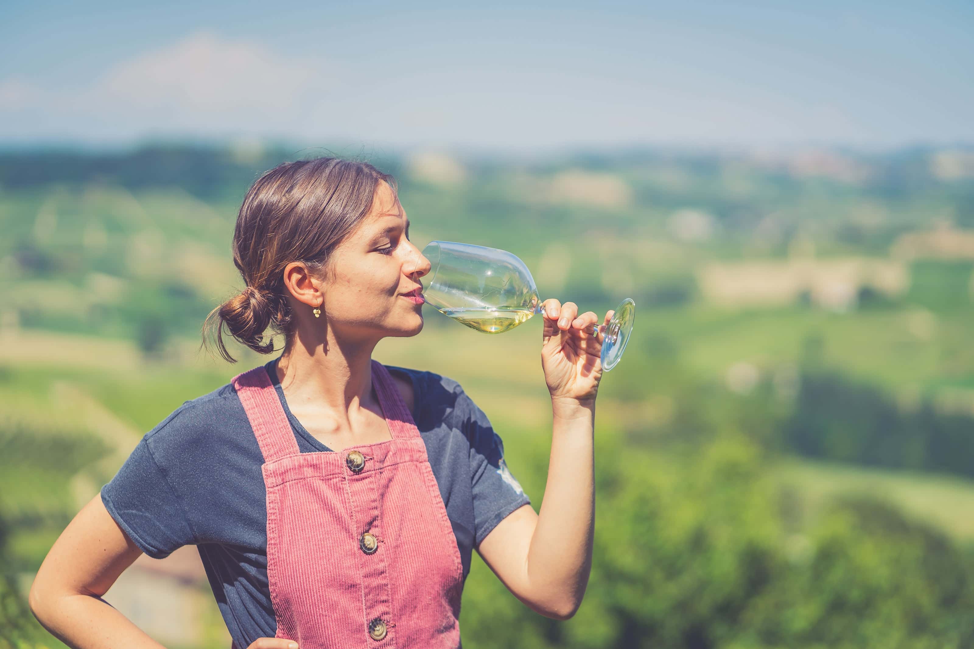 A girl with a glass of wine