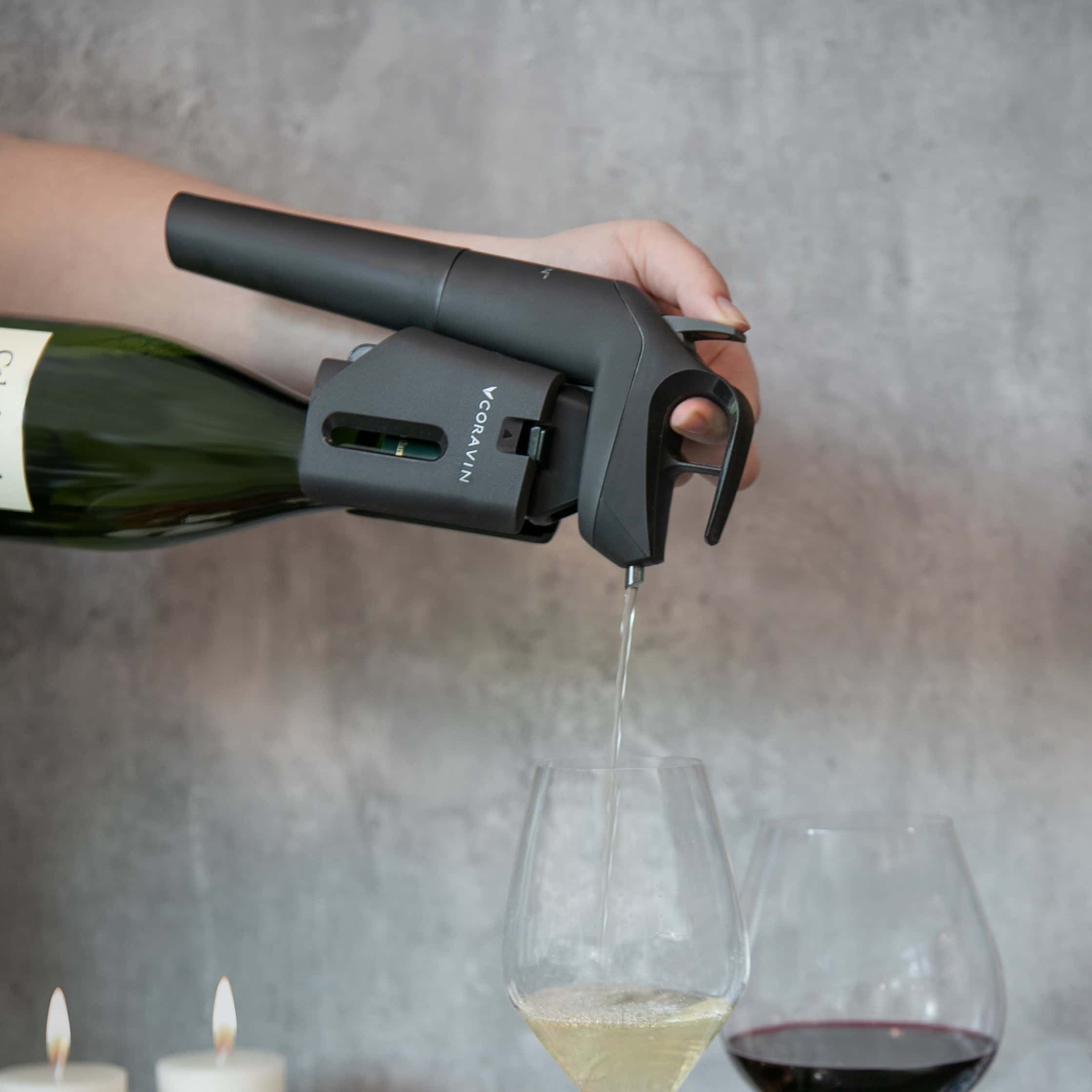 coravin timeless pouring into white and red wine glasses against grey background